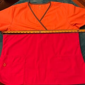 Wonder Wink Orange and Pink Scrub Top & Bottoms.